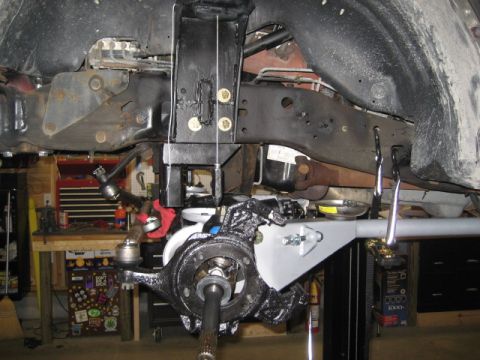 1996 Ford Bronco - Underneath view of a vehicle's suspension system during a repair or upgrade.