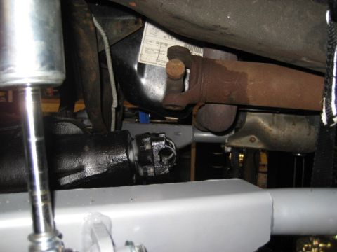 1996 Ford Bronco - Close-up view of the driveshaft and differential assembly on a 1996 Ford Bronco, showing a VIN sticker.