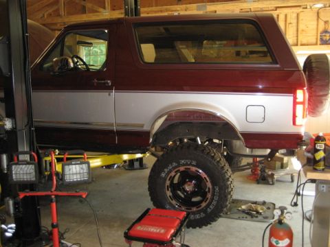 1996 Ford Bronco - This 1996 Ford Bronco is shown on a lift in a garage, undergoing maintenance or modification.