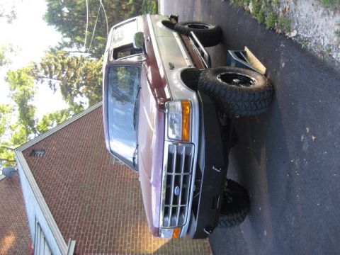 1996 Ford Bronco - This 1996 Ford Bronco features a two-tone paint scheme and is equipped with large aftermarket wheels.