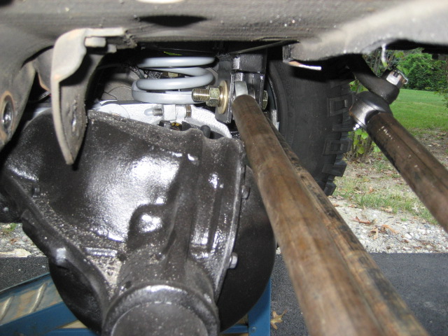 Rear axle assembly and suspension linkage on a vehicle, viewed from underneath
