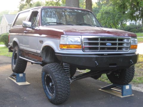 1996 Ford Bronco - This 1996 Ford Bronco features a custom front bumper and a lifted suspension, giving it an aggressive stance.