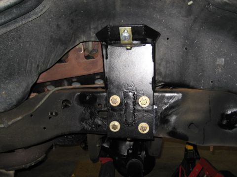 1996 Ford Bronco - Aftermarket suspension part installed on a vehicle frame.