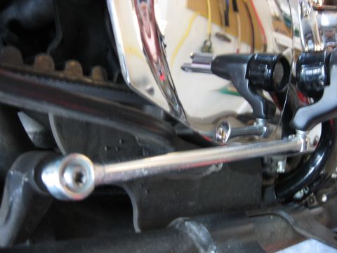 2004 Harley-Davidson Sportster Custom - Close-up view of a motorcycle's drive belt and linkage system.