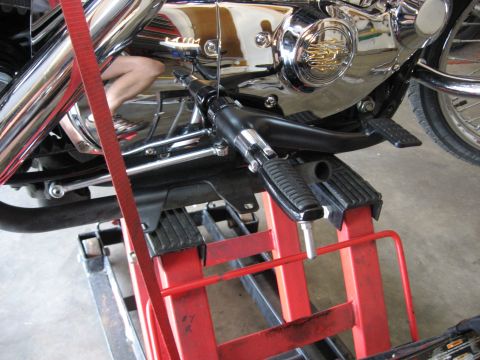 2004 Harley-Davidson Sportster Custom - Close-up view of the engine and foot controls of a 2004 Harley-Davidson Sportster Custom motorcycle.
