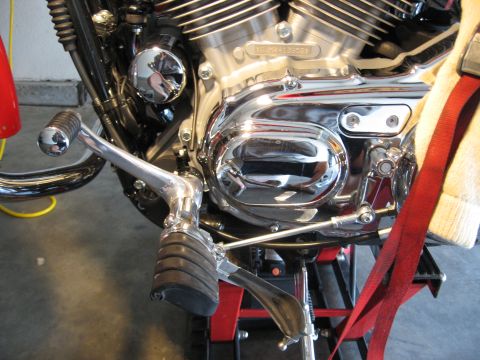 2004 Harley-Davidson Sportster Custom - Close-up view of a motorcycle's engine and control components, showing intricate mechanical details.