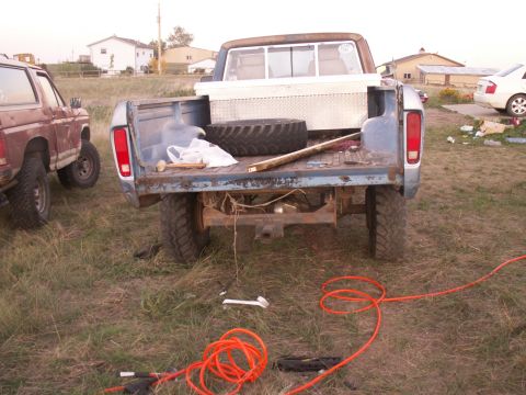 1977 Ford F-250 - This 1977 Ford F-250 pickup truck is seen from the rear, with a toolbox and spare tire in its bed.