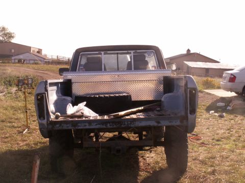 1977 Ford F-250 - Rear view of a 1977 Ford F-250 pickup truck, showing the bed and a toolbox.