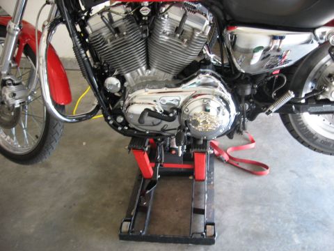 2004 Harley-Davidson Sportster Custom - Close-up of a 2004 Harley-Davidson Sportster Custom's engine and front wheel.
