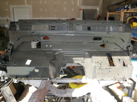 1974 Land Rover Land Rover - This is a vehicle's bulkhead, a structural component, shown in a workshop environment.