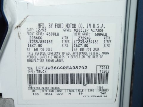 1994 Ford C-350 (Centurion Conversions) - Close-up of a vehicle's identification plate showing manufacturing details and VIN.