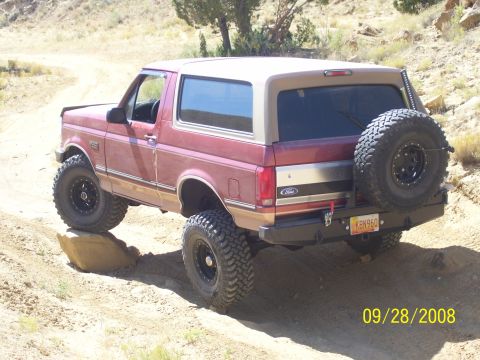 1993 Ford Bronco - This 1993 Ford Bronco is navigating a rocky trail in a dry, arid environment.