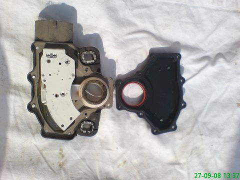 1994 Ford Thunderbird - Transmission solenoid pack and gasket laid out on a white cloth surface.