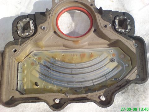 1994 Ford Thunderbird - This is a close-up view of a used automotive sensor part, showing its internal electronic components and a red gasket.