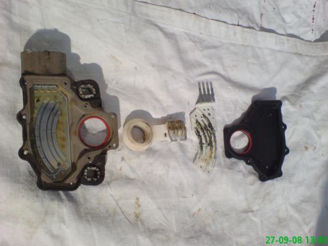 1994 Ford Thunderbird - Disassembled transmission solenoid pack with electrical components and seals on a white cloth.