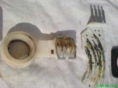 1994 Ford Thunderbird - Close-up of a damaged automotive electrical connector showing burnt wires and corrosion.