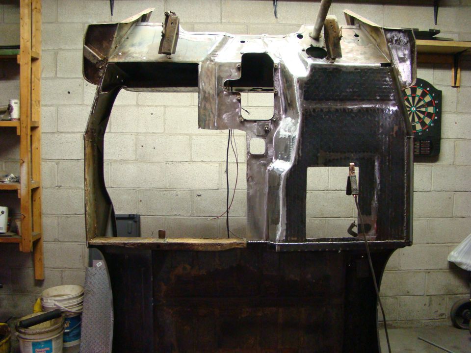 Metal body shell interior, dashboard area, with wiring visible