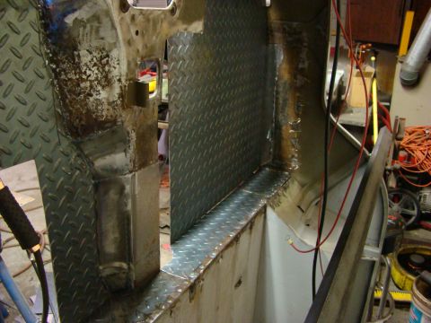 1948 Jeep Wrangler - Vehicle body repair in progress, showing diamond plate installation on the interior floor and wall.