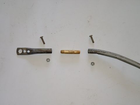 1978 Ford Ranchero - Metal linkage components are laid out on a white surface, ready for assembly.