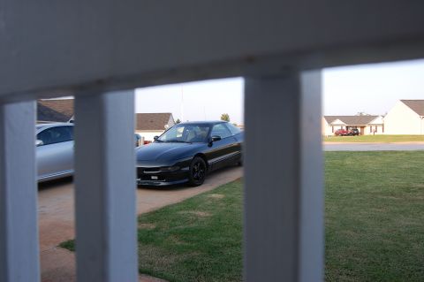 1996 Ford Probe - A black 1996 Ford Probe is parked in a suburban driveway.