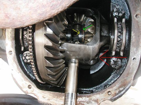 1989 Ford Bronco - Where to start with this picture. The pinion shaft is the bar hanging down out of the carrier. The green arrow is pointing to the C clip th…