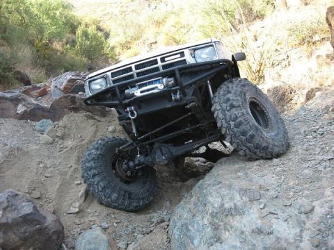 1986 Toyota Hilux - This 1986 Toyota Hilux navigates a rocky, off-road trail with its front end angled upwards.