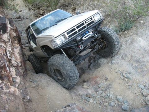 1986 Toyota Hilux - This modified 1986 Toyota Hilux is tackling a challenging rocky trail.
