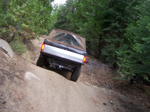 1991 Ford Bronco - This 1991 Ford Bronco is navigating a challenging off-road trail.