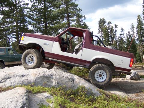 1991 Ford Bronco - This 1991 Ford Bronco navigates a rocky trail with a second SUV visible in the background.