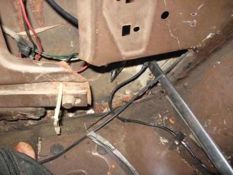 1991 Ford Bronco - Close-up of the interior of a vehicle, showing rusty metal components and a wiring harness, with a SuperMotors.net watermark visible.