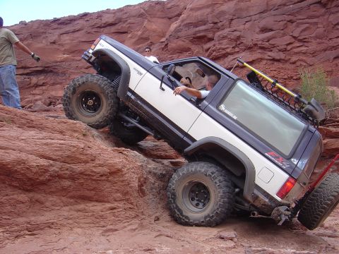 1986 Ford Bronco II - Off-roading in Moab: a 1986 Ford Bronco II navigates a challenging rock climb.