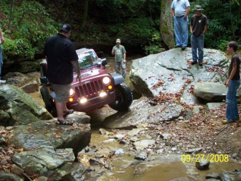 1992 Jeep Cherokee - A red Jeep Wrangler is shown off-roading through a rocky stream on September 27, 2008.