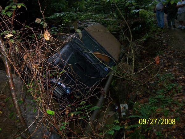 1992 Jeep Cherokee tilted in a ditch, front 3/4 view