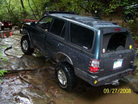 1992 Jeep Cherokee - Off-roading in a 1996 Toyota 4Runner on a wet, rocky path.
