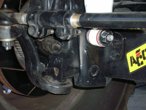 1996 Ford Bronco - This is the original hole, below the lower front shock mount, that is drilled for the original Rancho stabilizer, but it sits too low and h…