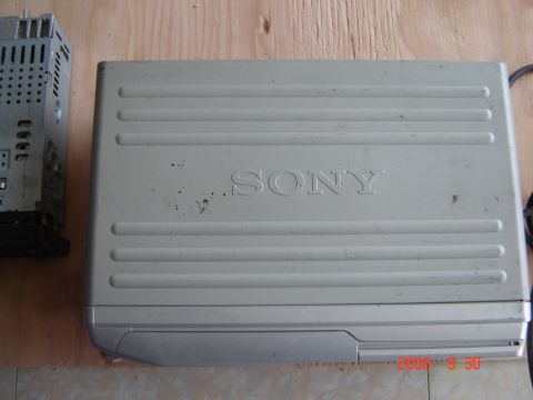 1993 Ford Bronco - Sony CD changer and car stereo receiver components shown on a wooden surface.