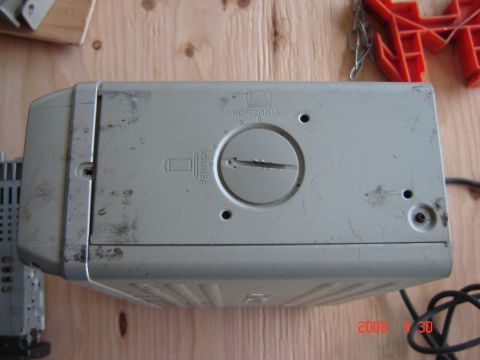 1993 Ford Bronco - A CD changer unit is shown, a central dial for horizontal and vertical adjustments.