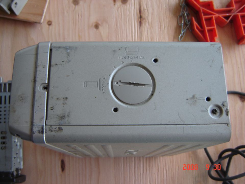 CD changer with horizontal and vertical adjustment dial
