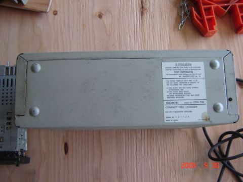1993 Ford Bronco - A Sony CDX-705 Compact Disc Changer is shown from the bottom, with its certification label visible.