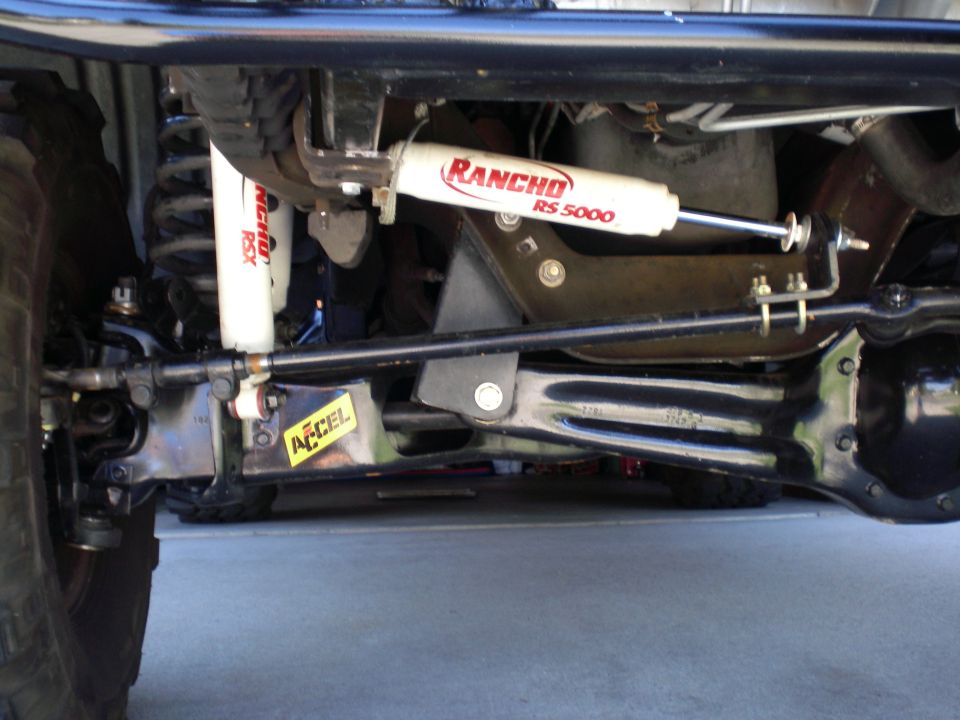 Front suspension underside showing Rancho RS5000 and RSX shocks and ACCEL steering stabilizer