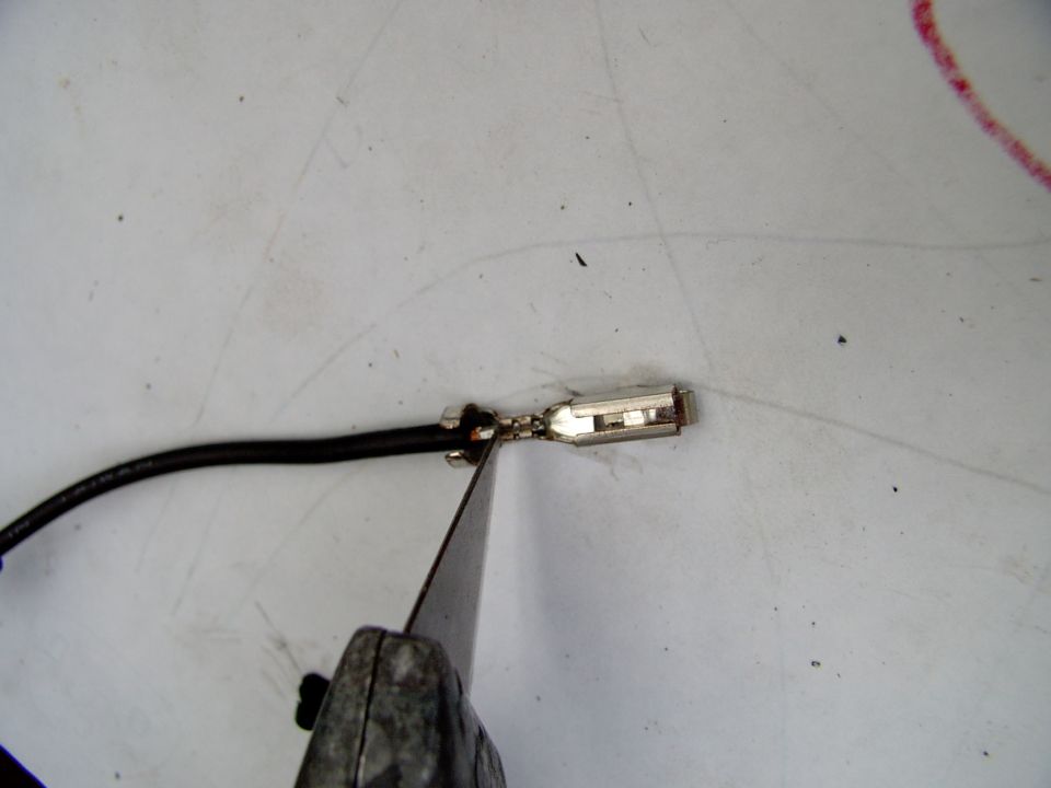 Press down with the carpet knife and just pull up on the wire and bend and break the rest of the strands. It's really easy this way.