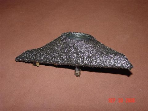 1993 Ford Probe - This is a custom part, possibly a speaker grille or trim piece, with a textured black finish and metal mounting clips.