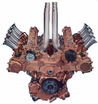 1978 Ford Mustang II - A complex V12 engine assembly with prominent intake and exhaust systems is shown against a white background.