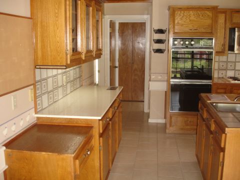 1989 Ford Bronco - Interior view of a kitchen oak cabinetry and a double oven range.