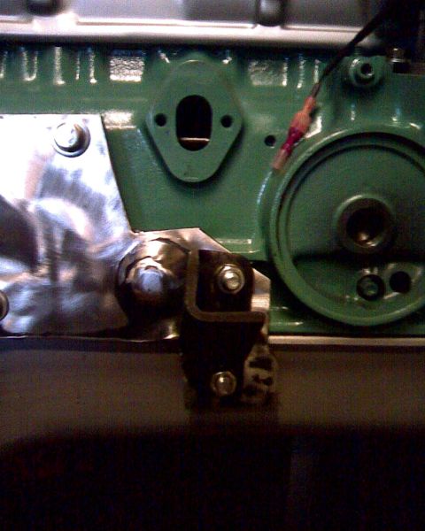 1953 Ford Mainline - Engine block detail with oil filter housing and a metal bracket attached.