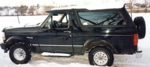 1994 Ford Bronco - Side shot in the snow.