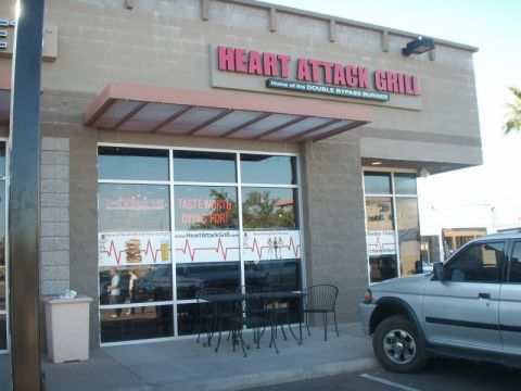 1989 Ford Bronco - Exterior view of the Heart Attack Grill restaurant with a silver SUV parked to the right.