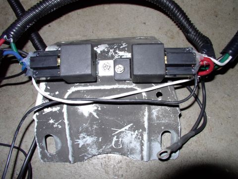 1990 Lincoln Town Car - Relay mounting point close up. I just yanked the headlight support and screwed the relays to it. With the stock plastic cover shroud back i…