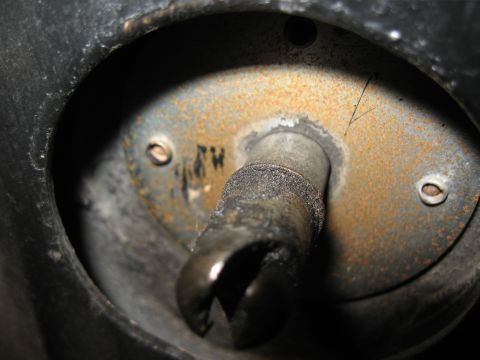1968 Shelby GT500 - A detailed view of a hood pin rivet mechanism, showing signs of age and use.