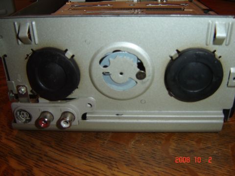 1993 Ford Bronco - Rear of a car stereo unit showing RCA inputs and mounting points.